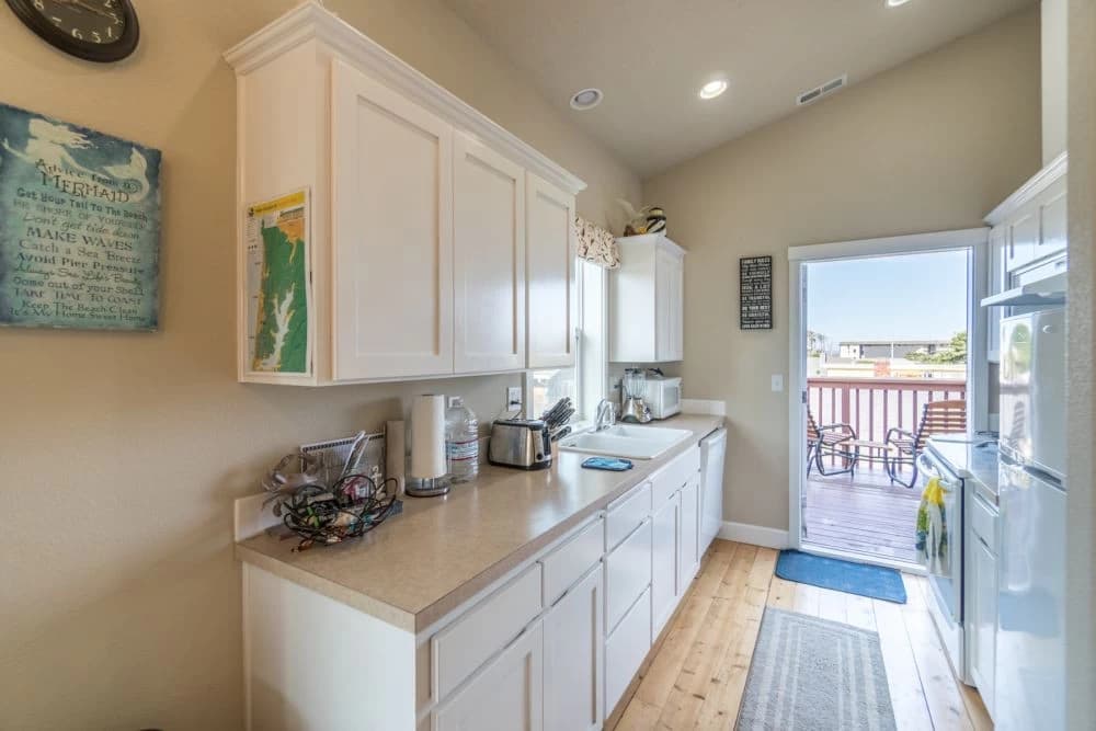 Galley kitchen with deck view