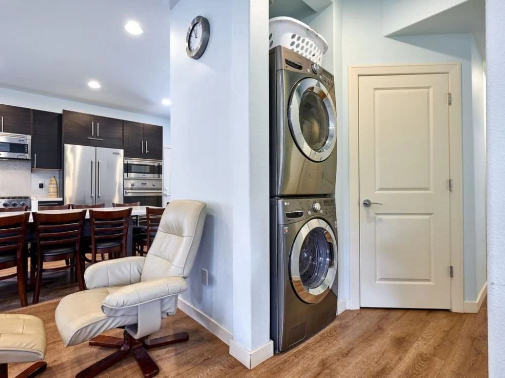 Laundry room with stacked washers