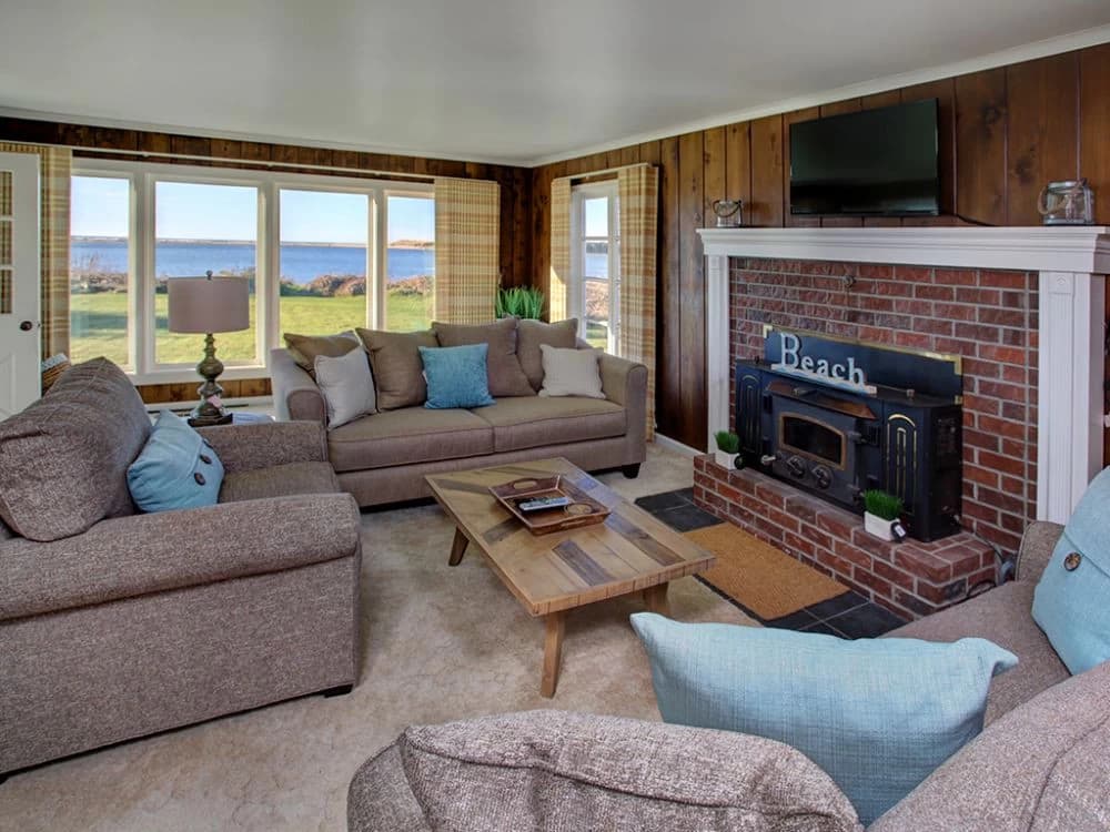 Ocean-view living room with fireplace