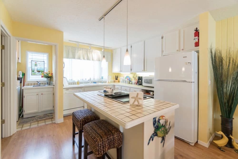 Bright yellow kitchen with island