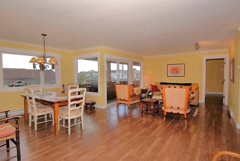 Bright yellow living room with dining area