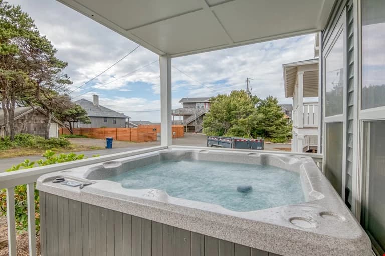 Covered hot tub with ocean view