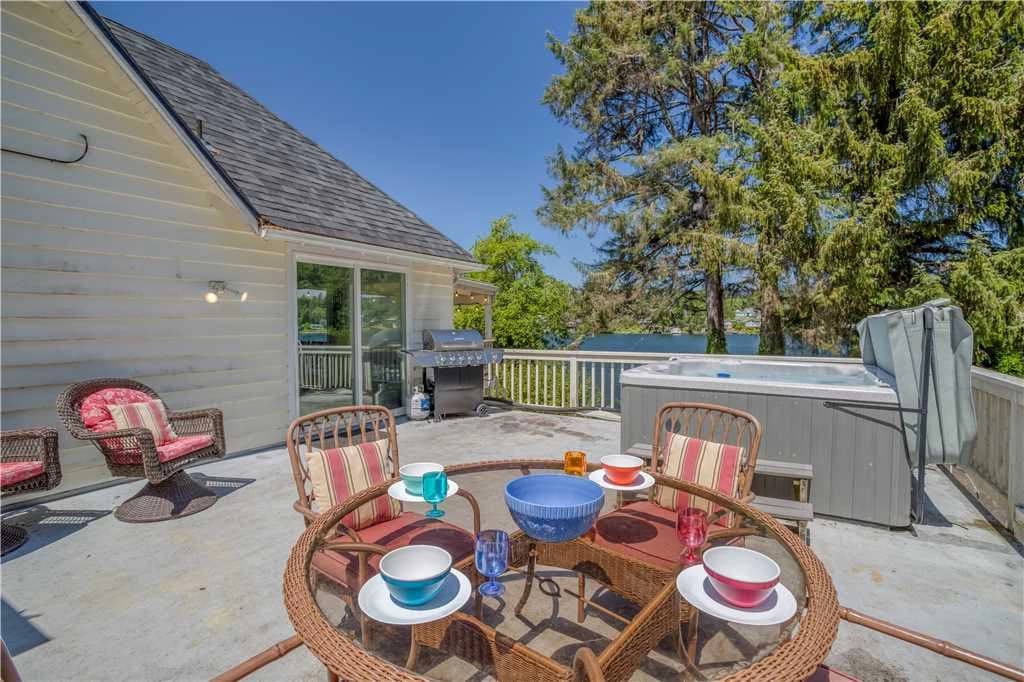 Lakeside deck with hot tub