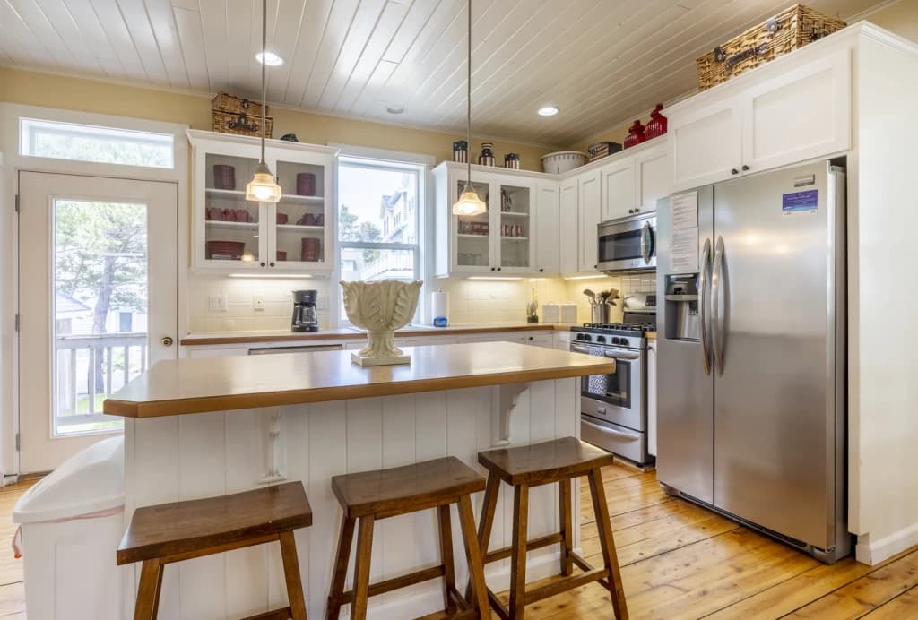 Spacious white kitchen with island