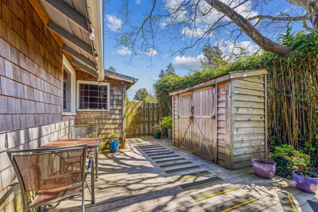 Backyard deck with sheds