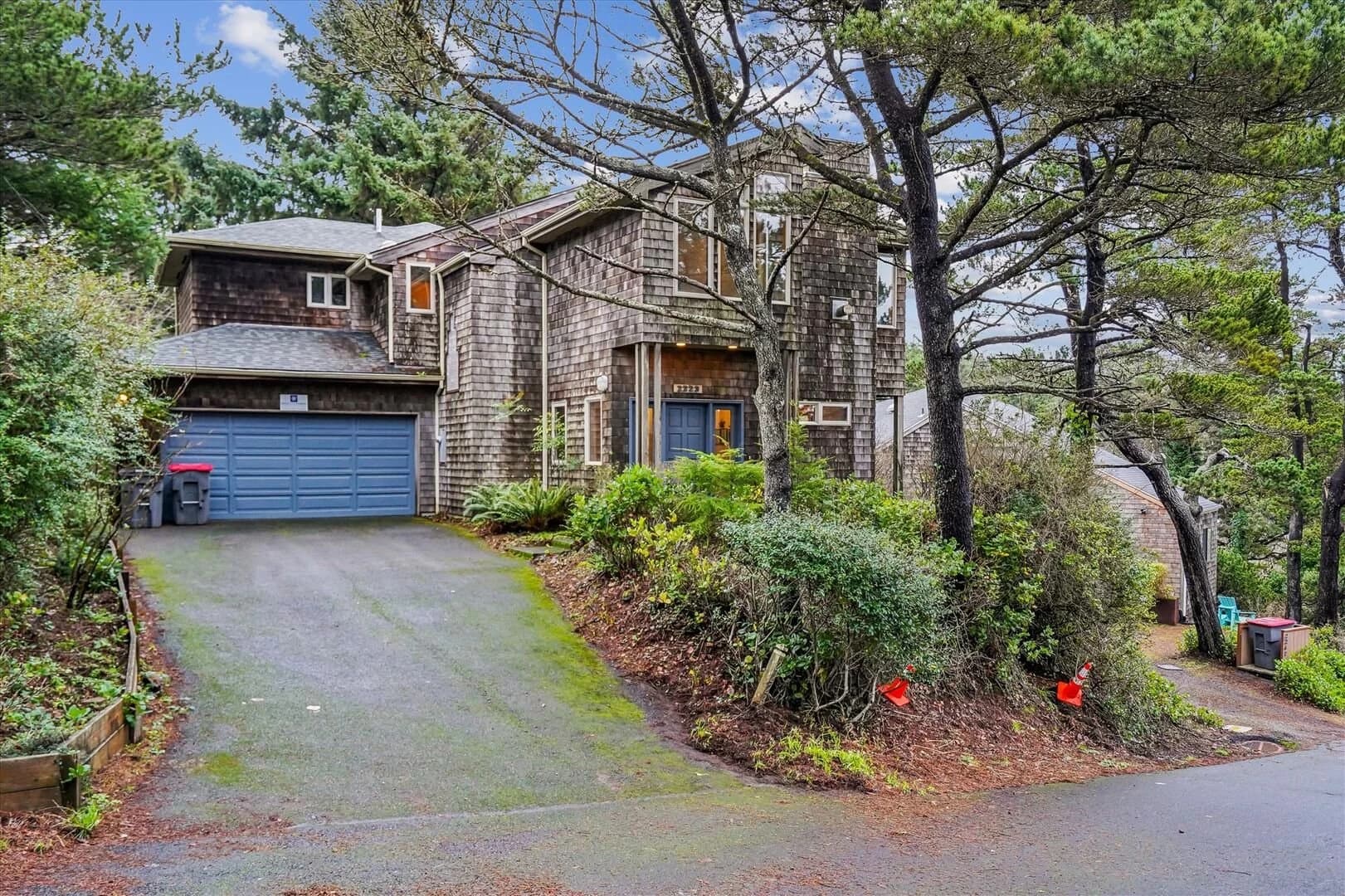 Pacific Vista — Wooded driveway entrance