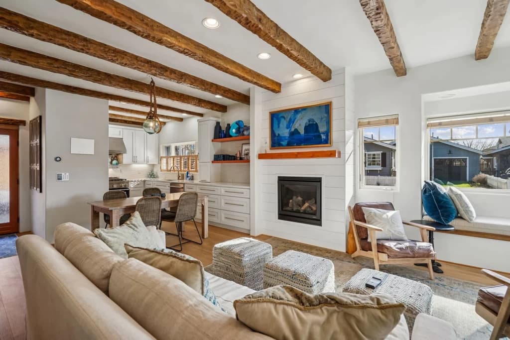 Open-concept living area with beams